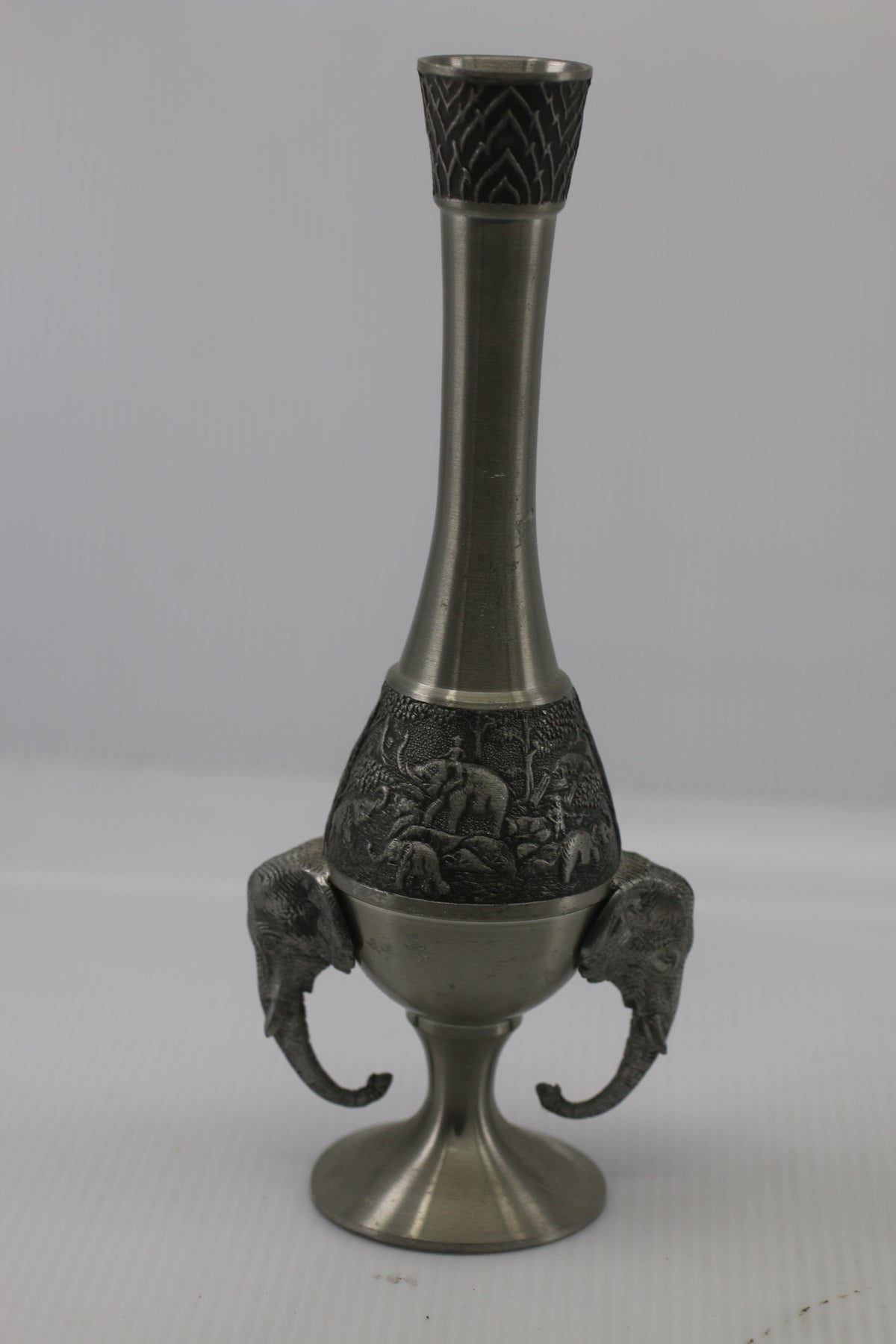 Thai vase in white metal decorated with elephant heads and friezes
