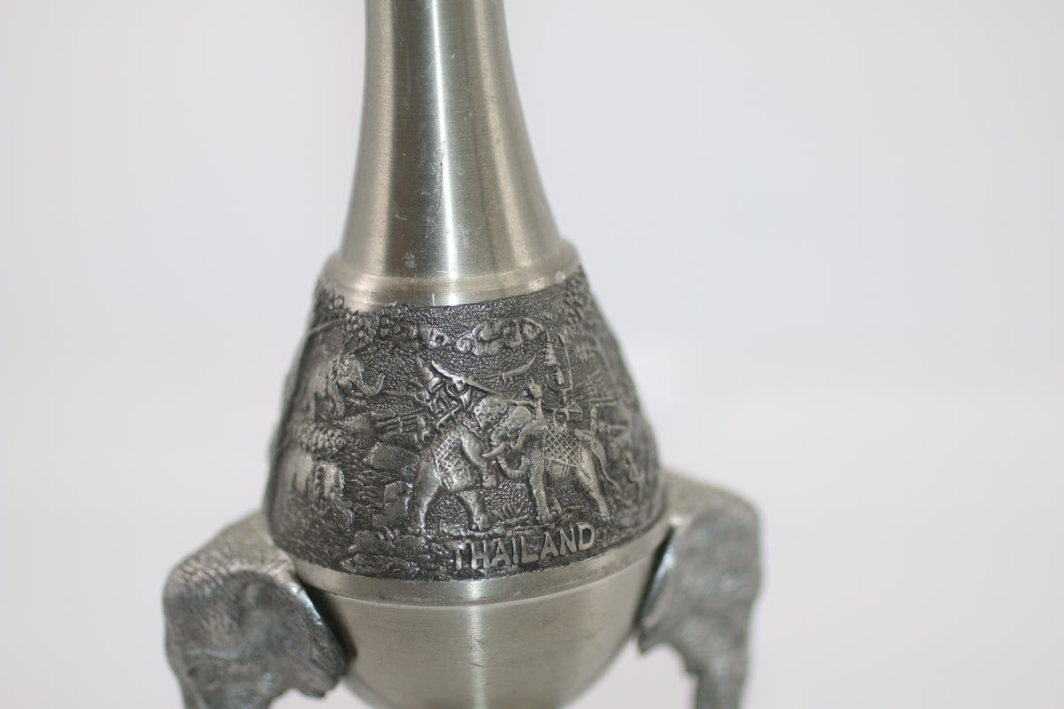 Thai vase in white metal decorated with elephant heads and friezes