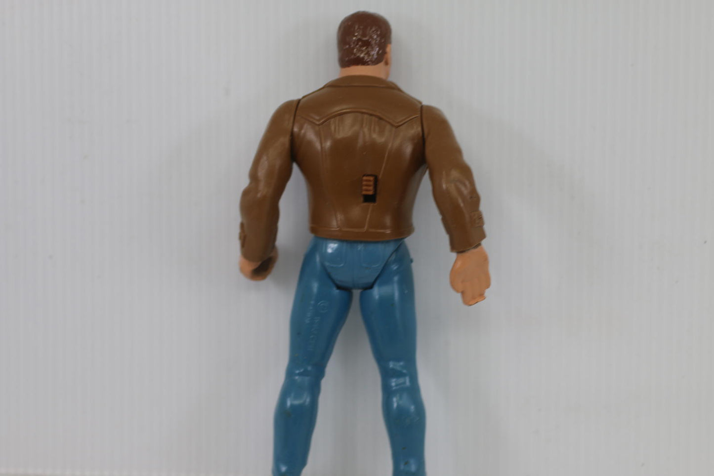 Vintage Male Action Figure with Brown Jacket and Blue Pants