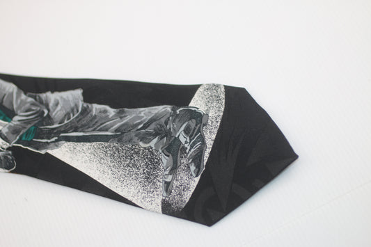 Marbella James Bond style logo drawing on the tie