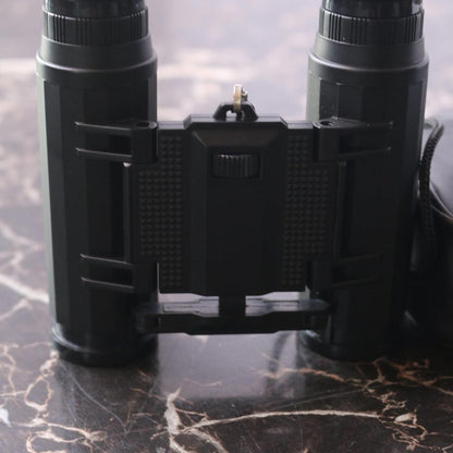 Small binoculars for kids or travel no trademark written w/ leather Storage case