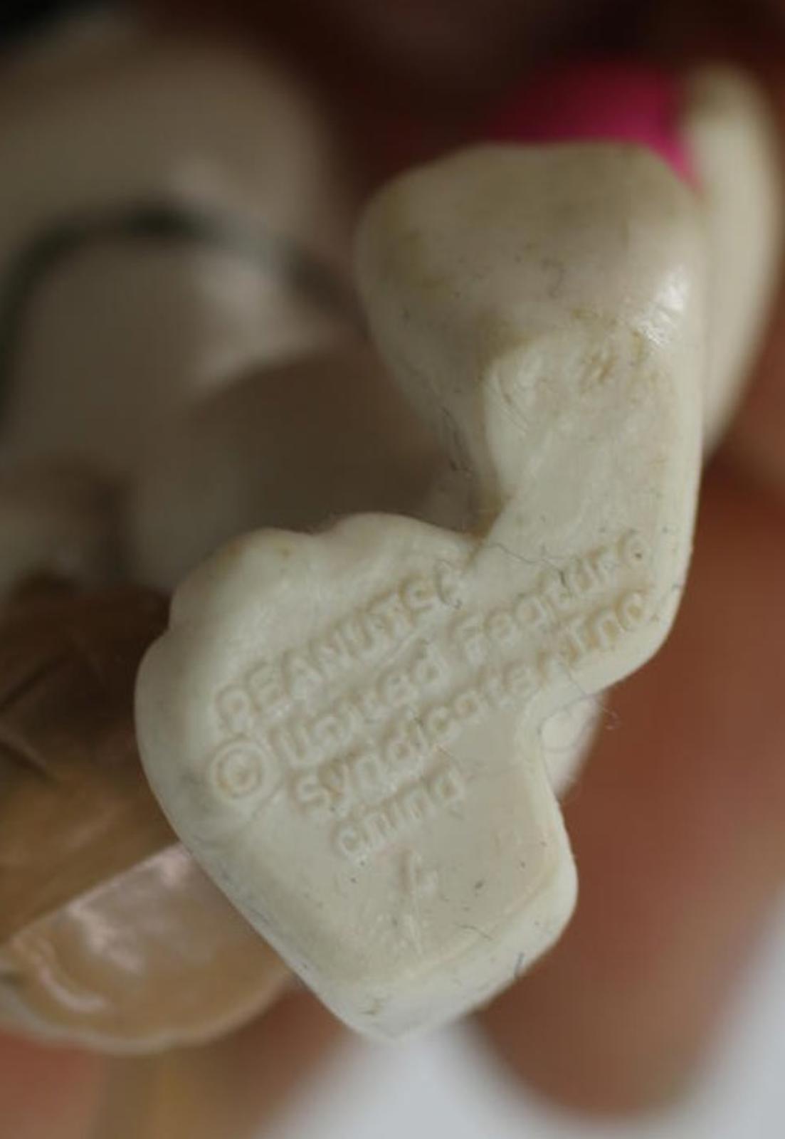 EASTER PEANUTS SNOOPY CARRYING A EASTER BASKET AND A PINK EGG 2 1/2" TALL