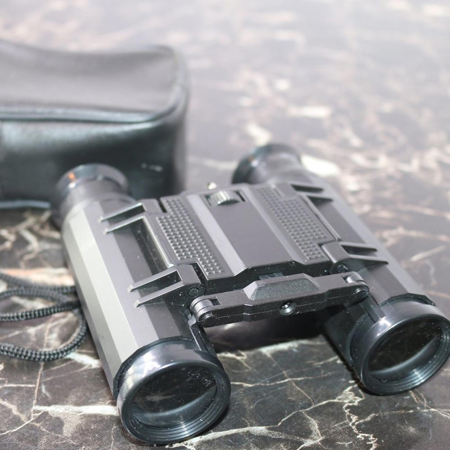 Small binoculars for kids or travel no trademark written w/ leather Storage case