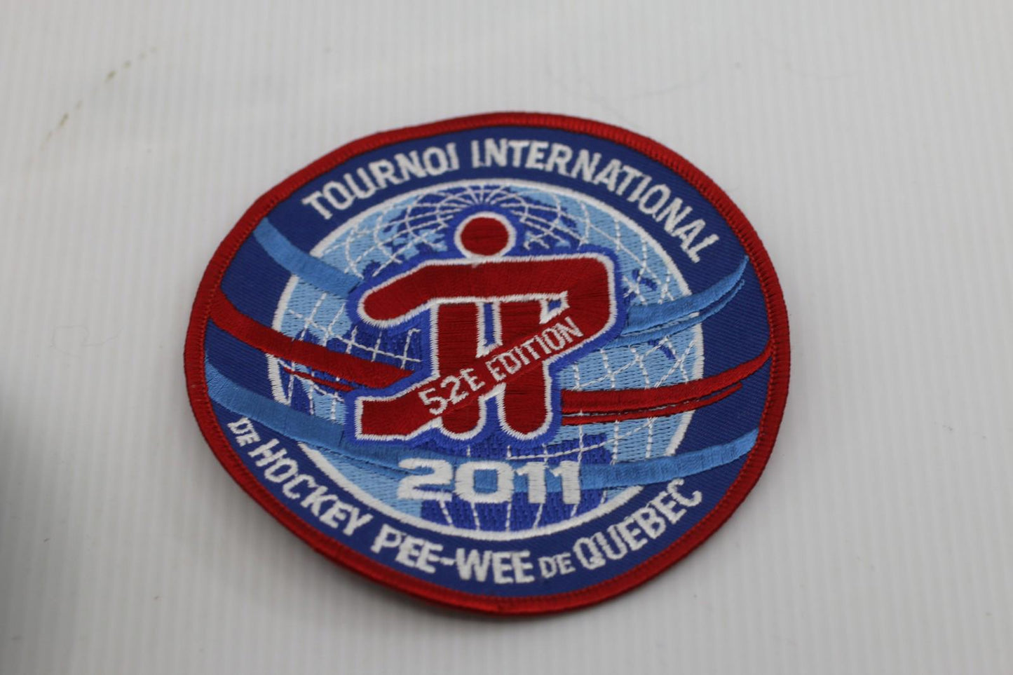Écusson officiel – Tournoi International de Hockey Pee-Wee de Québec 2011 (52e é