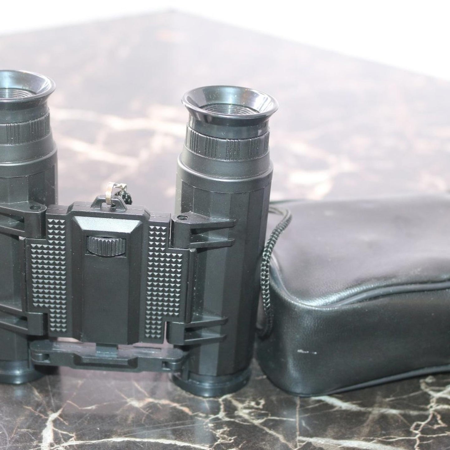 Small binoculars for kids or travel no trademark written w/ leather Storage case