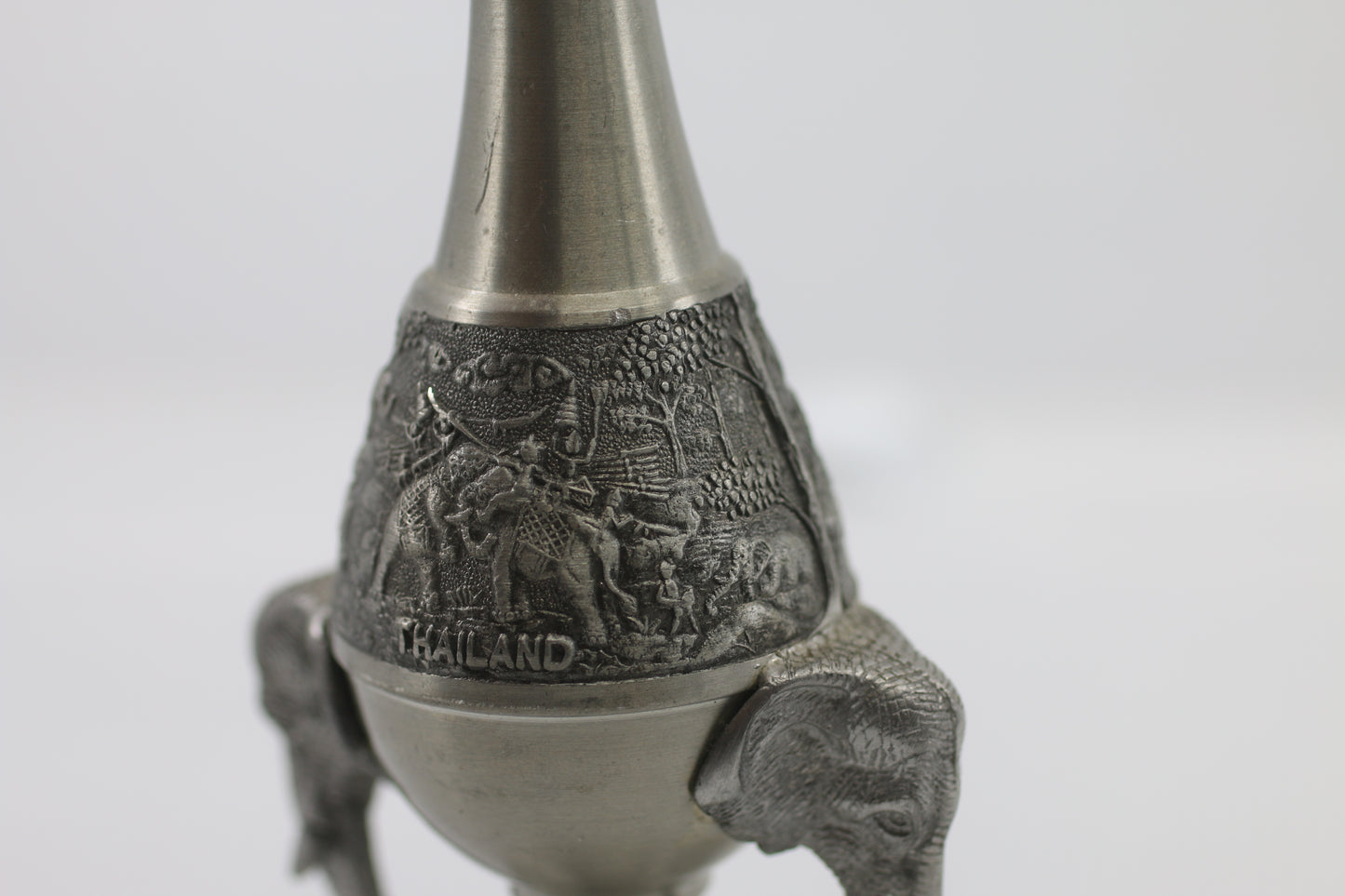 Thai vase in white metal decorated with elephant heads and friezes