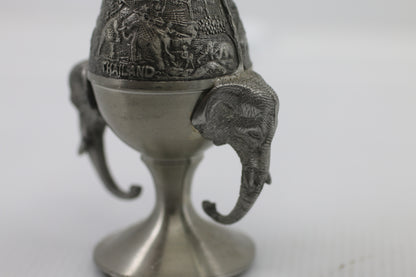 Thai vase in white metal decorated with elephant heads and friezes