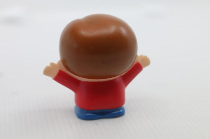 Small Plastic Figurine Toy with Brown Hair and Red Shirt