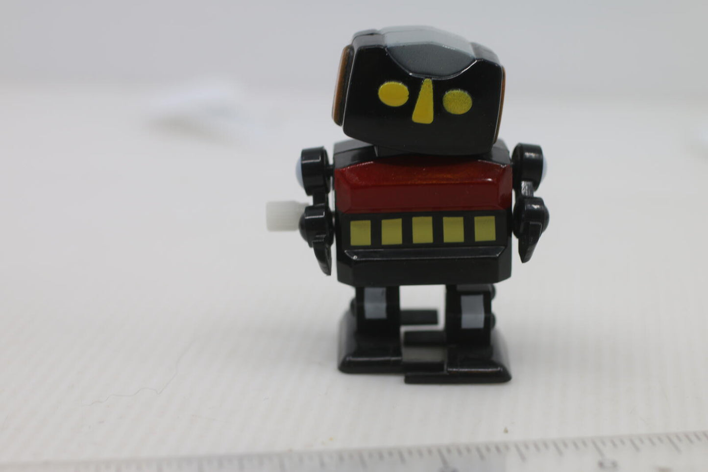 Vintage Wind-Up Robot Toy with Yellow and Red Details