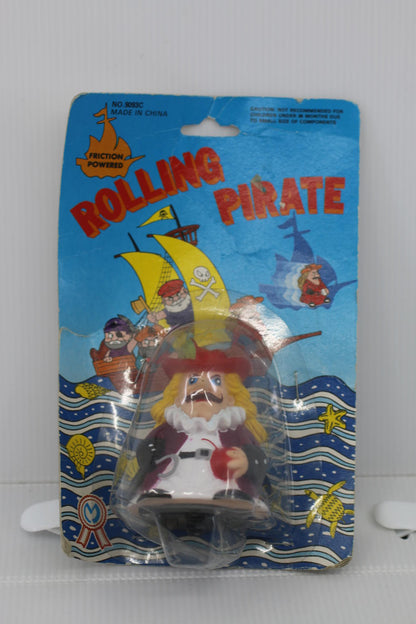 Vintage Rolling Pirate Friction Powered Toy figure toy on card