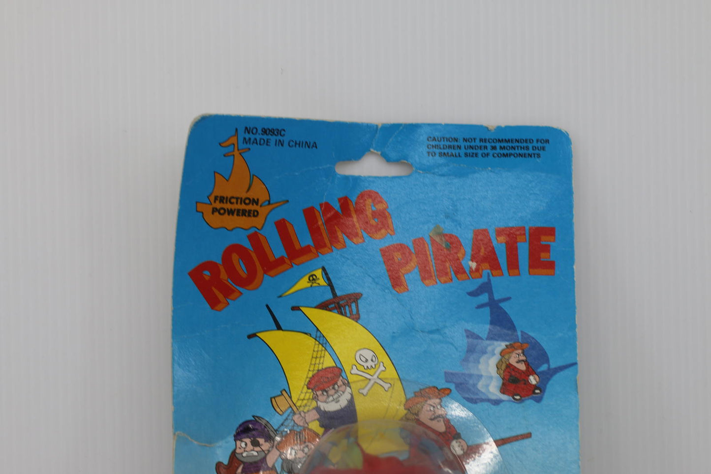 Vintage Rolling Pirate Friction Powered Toy figure toy on card