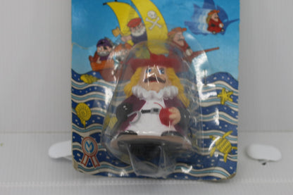 Vintage Rolling Pirate Friction Powered Toy figure toy on card