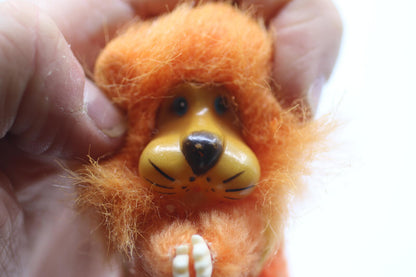 Vintage Orange Fuzzy Lion Figurine Pencil Clip hands