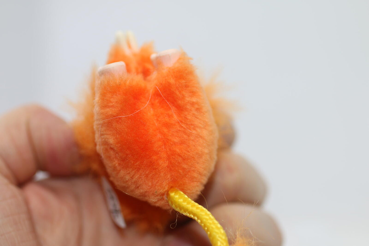 Vintage Orange Fuzzy Lion Figurine Pencil Clip hands