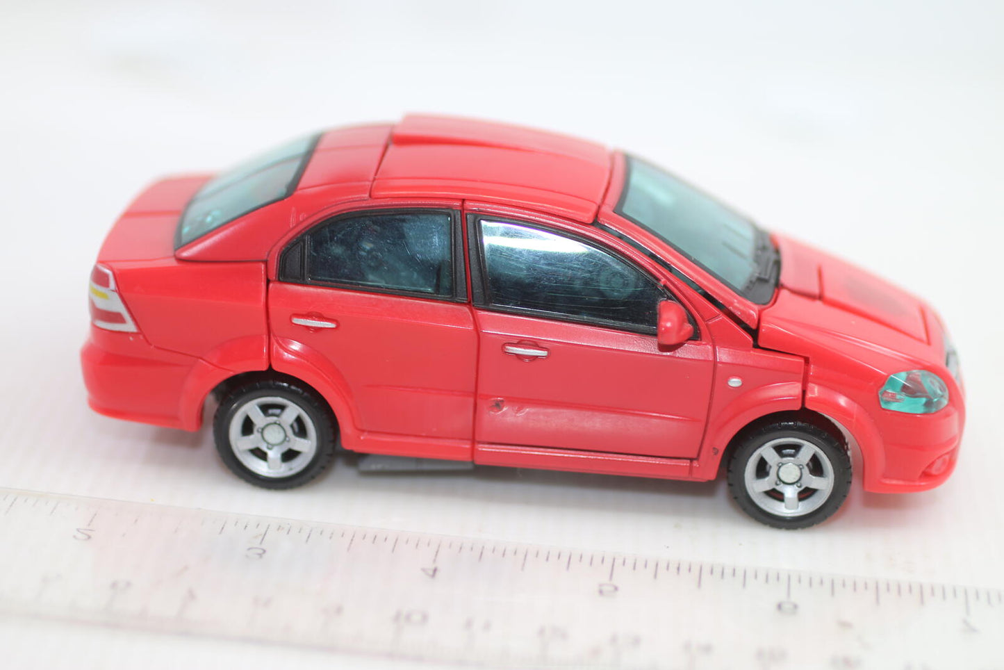 Transformers classic Universe Autobot Swerve Chevy Aveo Robot in disguise 2007