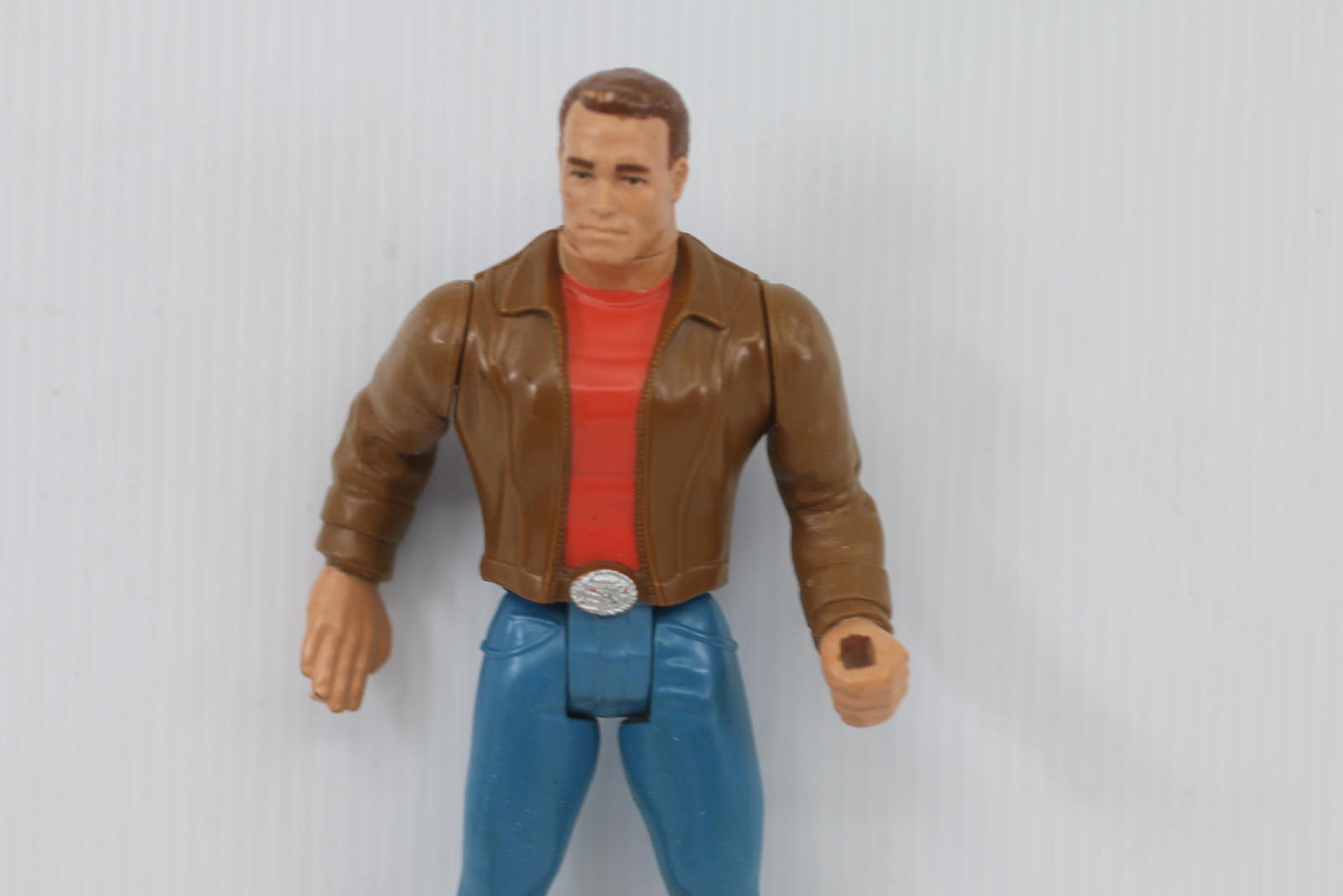 Vintage Male Action Figure with Brown Jacket and Blue Pants