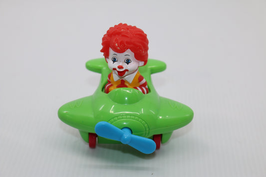 VINTAGE MCDONALDS TOY RONALD MCDONALD IN GREEN PLANE WITH WHEELS