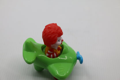 VINTAGE MCDONALDS TOY RONALD MCDONALD IN GREEN PLANE WITH WHEELS