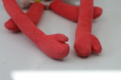 Plush Stuffed Toy with Long Red Limbs and Smiling Face Les Monstres à Câlins