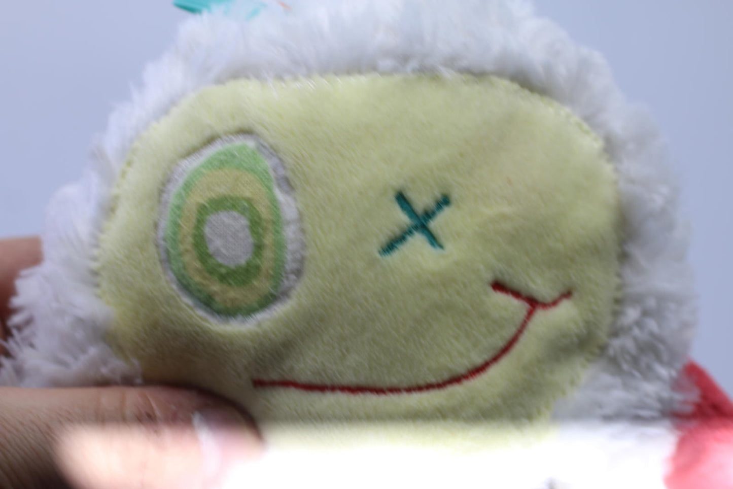 Plush Stuffed Toy with Long Red Limbs and Smiling Face Les Monstres à Câlins