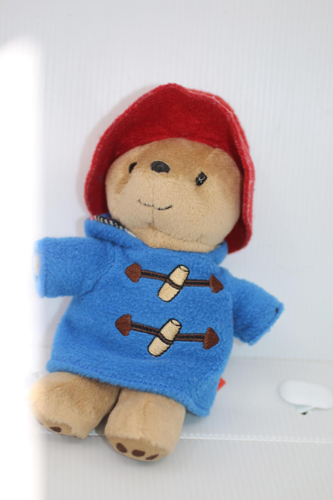 Plush Bear Toy with Blue Coat and Red Hat Rainbow