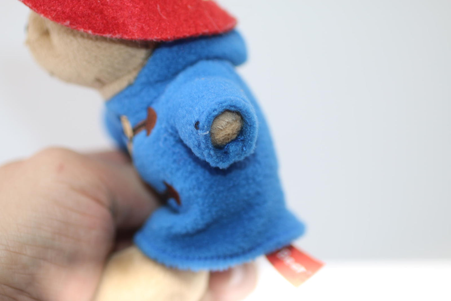 Plush Bear Toy with Blue Coat and Red Hat Rainbow