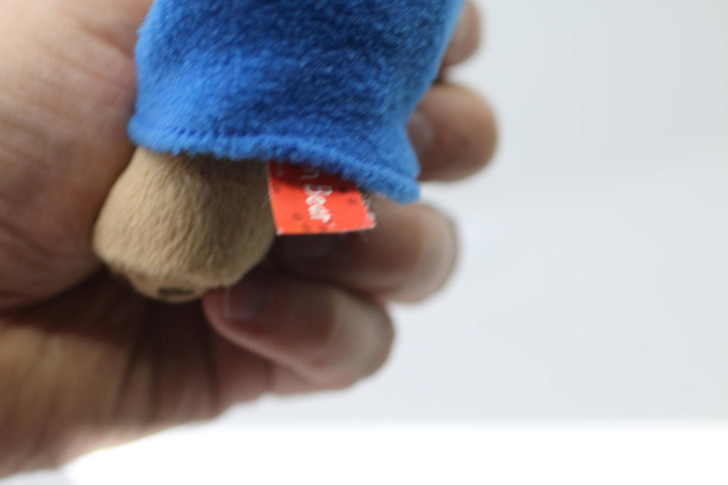 Plush Bear Toy with Blue Coat and Red Hat Rainbow