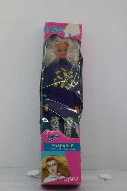 Sandi Poseable 11 1/2 Inch Fashion Doll by Totsy with a purple pull in box