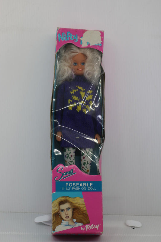 Sandi Poseable 11 1/2 Inch Fashion Doll by Totsy with a purple pull in box