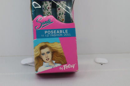 Sandi Poseable 11 1/2 Inch Fashion Doll by Totsy with a purple pull in box