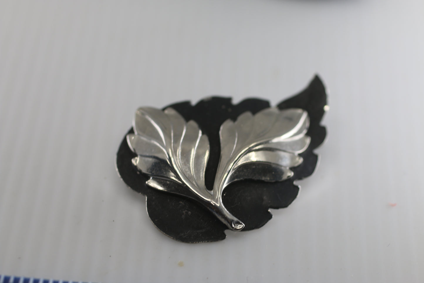 Rare vintage Flower leafs silver tone on black brooch