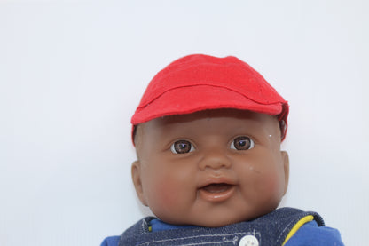 cabbage patch kids cloth on a berenguer african baby doll with red cap