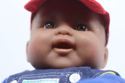 cabbage patch kids cloth on a berenguer african baby doll with red cap