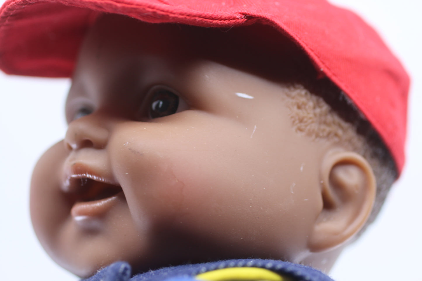 cabbage patch kids cloth on a berenguer african baby doll with red cap