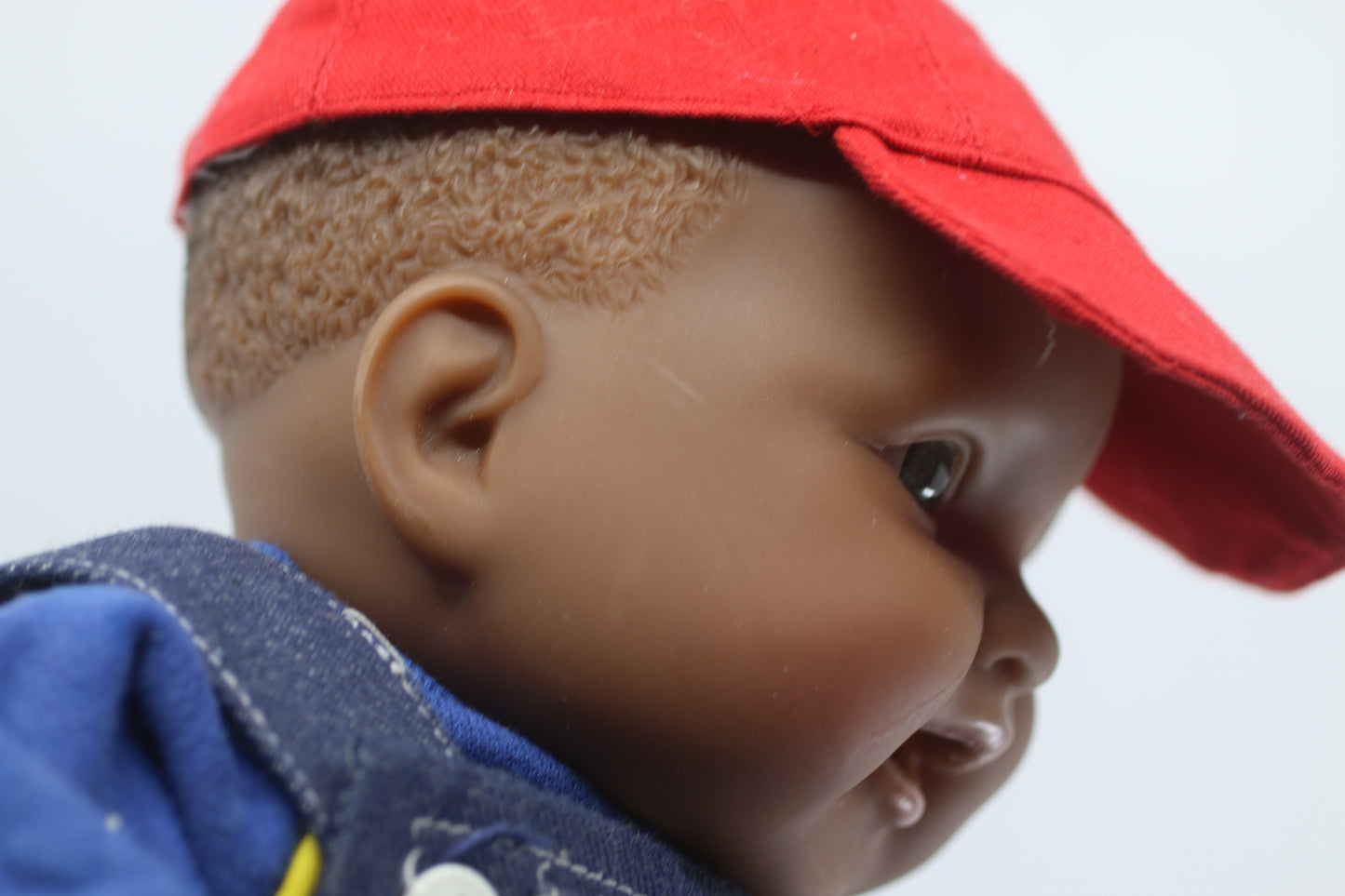 cabbage patch kids cloth on a berenguer african baby doll with red cap