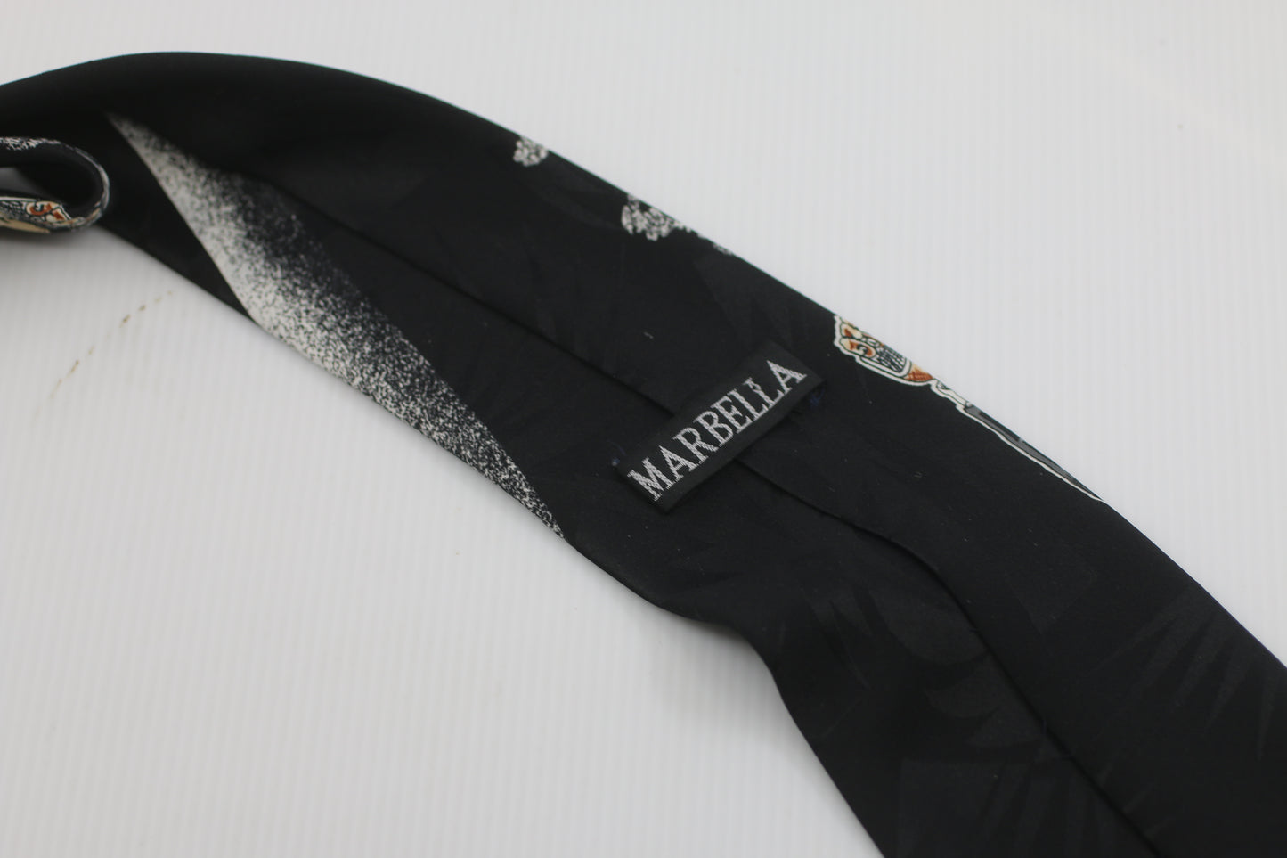 Marbella James Bond style logo drawing  on the tie