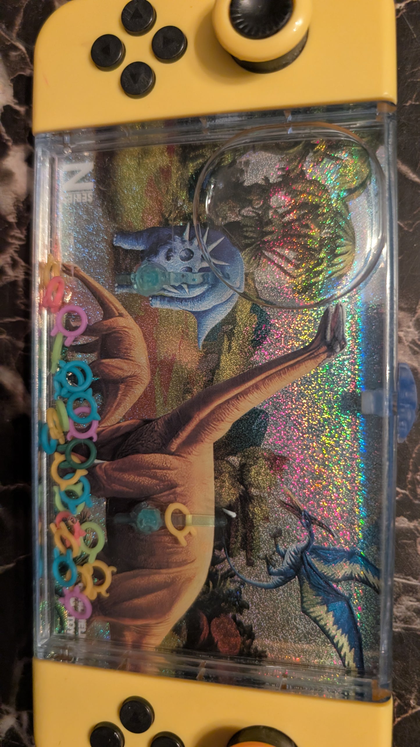 Dino World Handheld Water Ring Game Dinosaur Toy – Classic Push Button Game