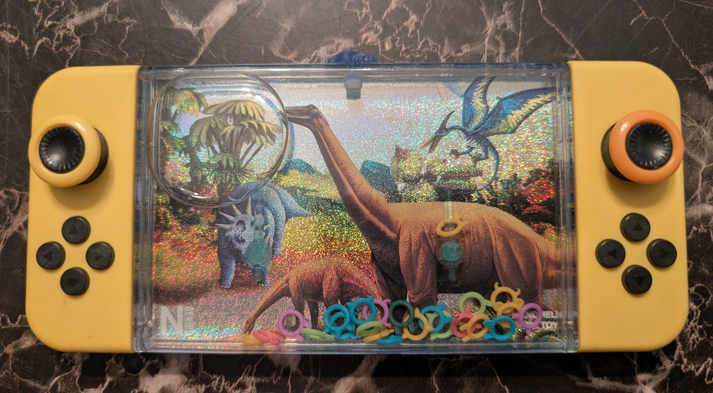 Dino World Handheld Water Ring Game Dinosaur Toy – Classic Push Button Game
